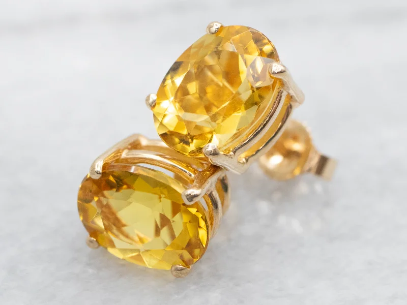 Trendy ear cuffs for bold fashion statements -Oval Cut Yellow Beryl Stud Earrings